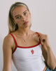 Image de la veste Icah en blanc avec bordure rouge et fraise