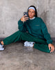 Image de Glo Sweatshirt en vert bouteille avec Take Care Of Yourself Embro