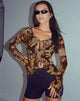 image de Sansa Cardi en or papillon