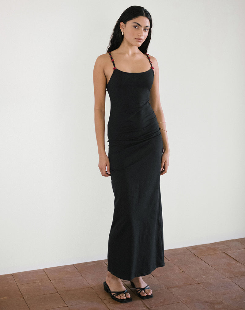 Robe longue Cantana en noir avec rosette rouge