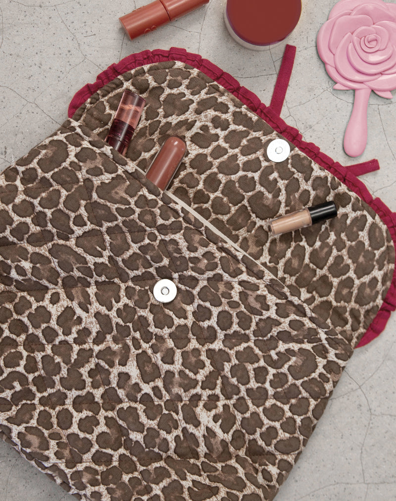 Image de la trousse de maquillage pliable en léopard avec nœud volant rouge