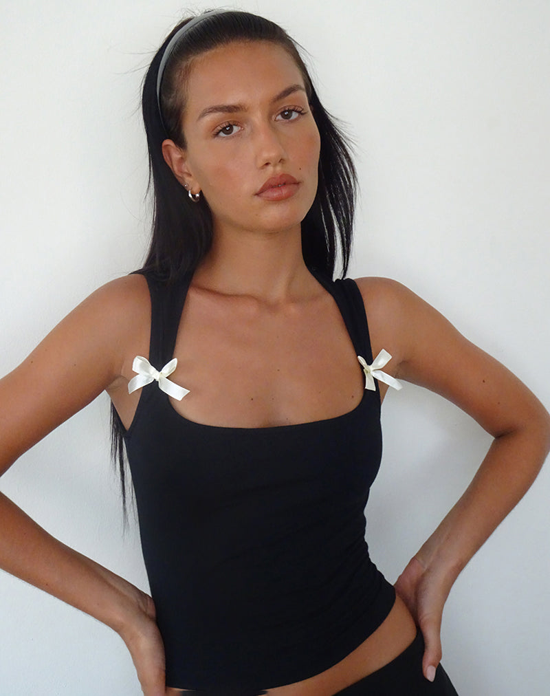 Jiniso Crop Top en noir avec nœuds en ivoire