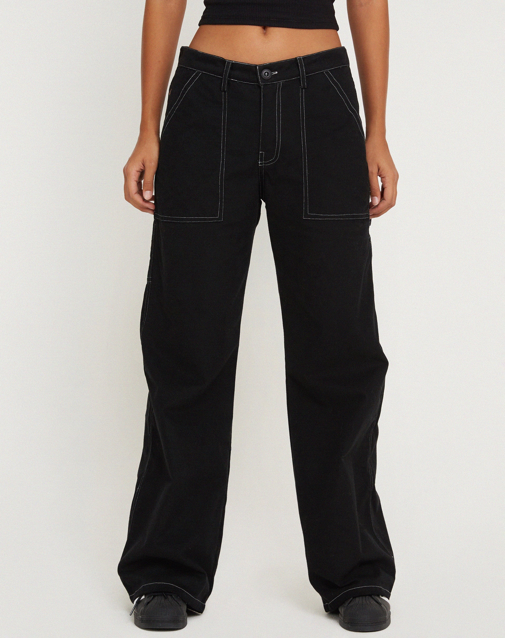 Image de Kusnaedi Pantalon à jambes larges en noir et blanc à surpiqûres