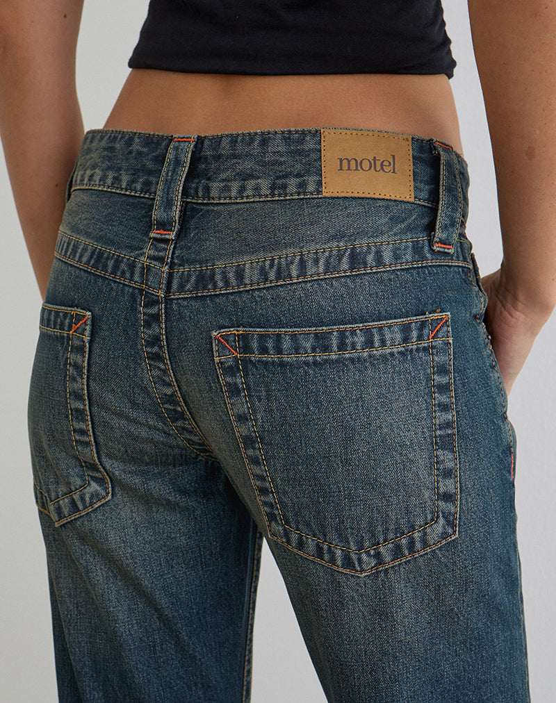 Image d'un jean taille basse à coutures torsadées dans les tons vert sale des années 80