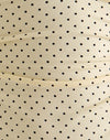 Crème avec impression micro-polka noire