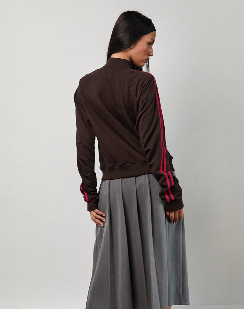 Image de la veste Niskala en chocolat amer avec reliure et broderie rouge adrénaline