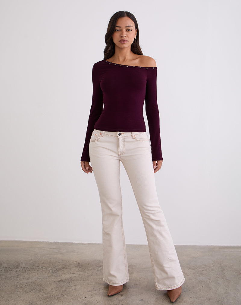 Top asymétrique Noraba en bois rouge avec œillets