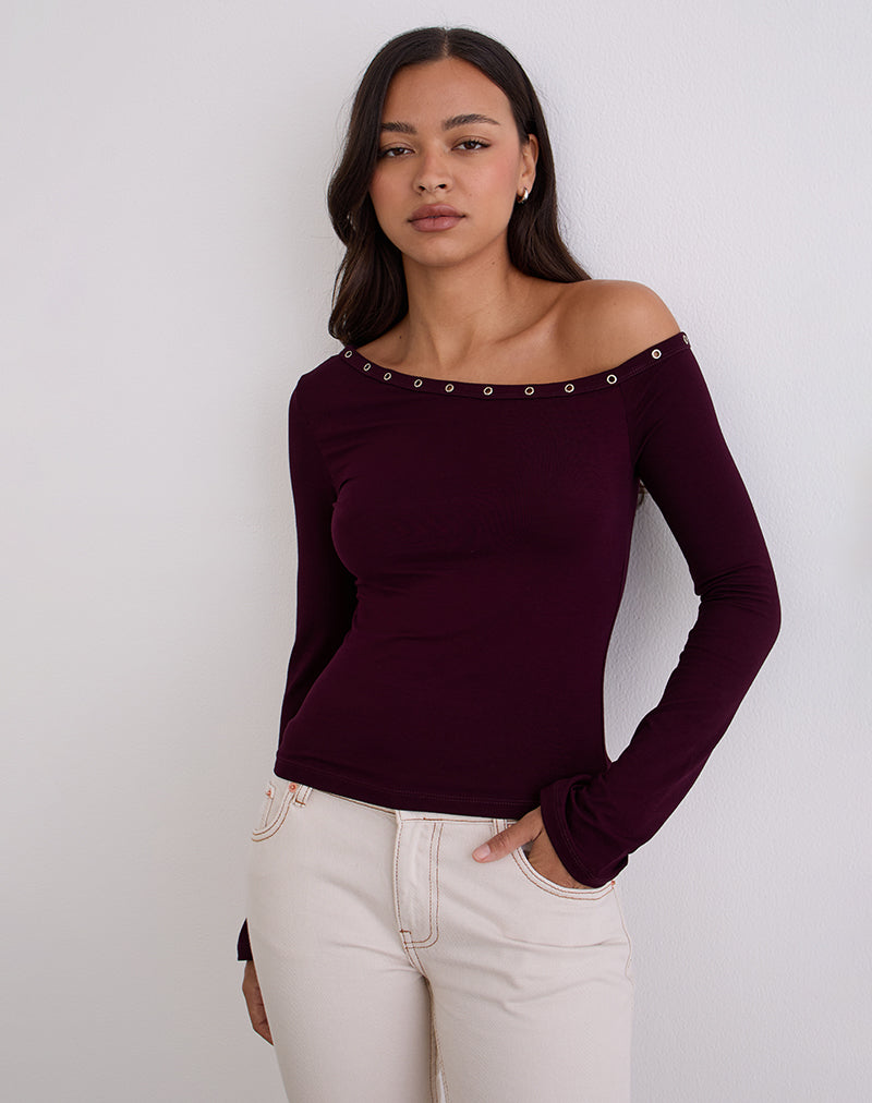 Top asymétrique Noraba en bois rouge avec œillets