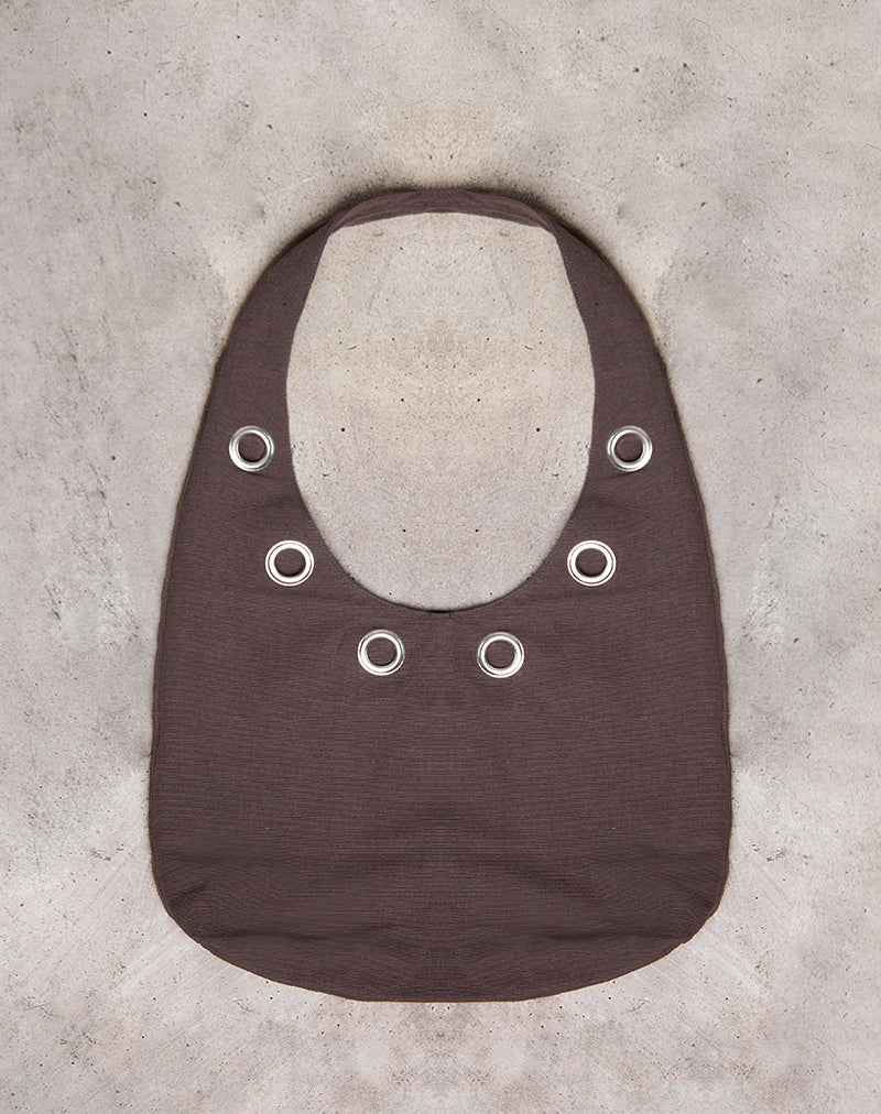 Sac à bandoulière Oru en marron avec œillets