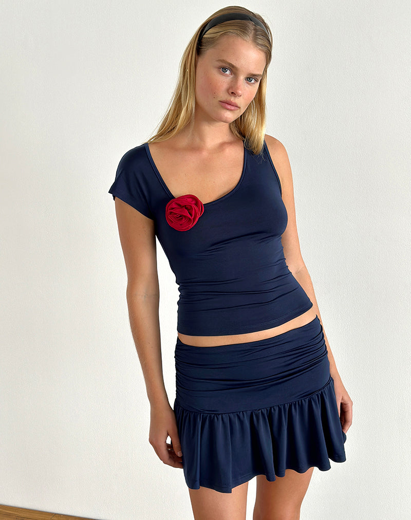 Top Rayla en lycra marine foncé avec rosette rouge