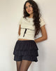 Image de Sabine Top en beige avec reliure noire