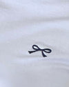 Blanc avec reliure marine