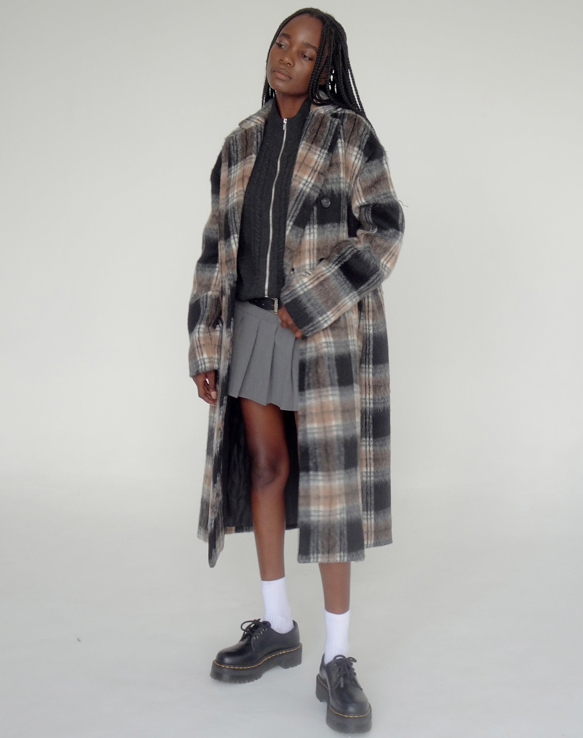image du manteau Sawai en noir et marron