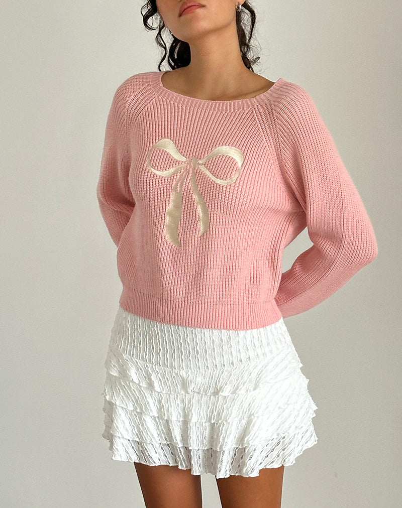 Pull Tami en tricot rose avec broderie de nœuds blancs