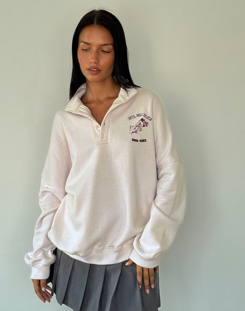 Pull universitaire en blanc d'hiver avec broderie bourguignonne du club de ski