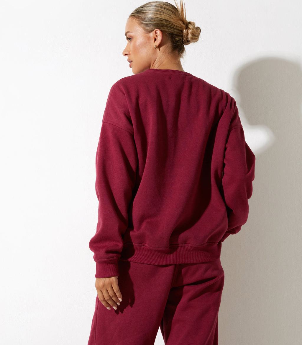 Sweatshirt Glan en bourgogne avec broderie "Winning Team" (équipe gagnante)